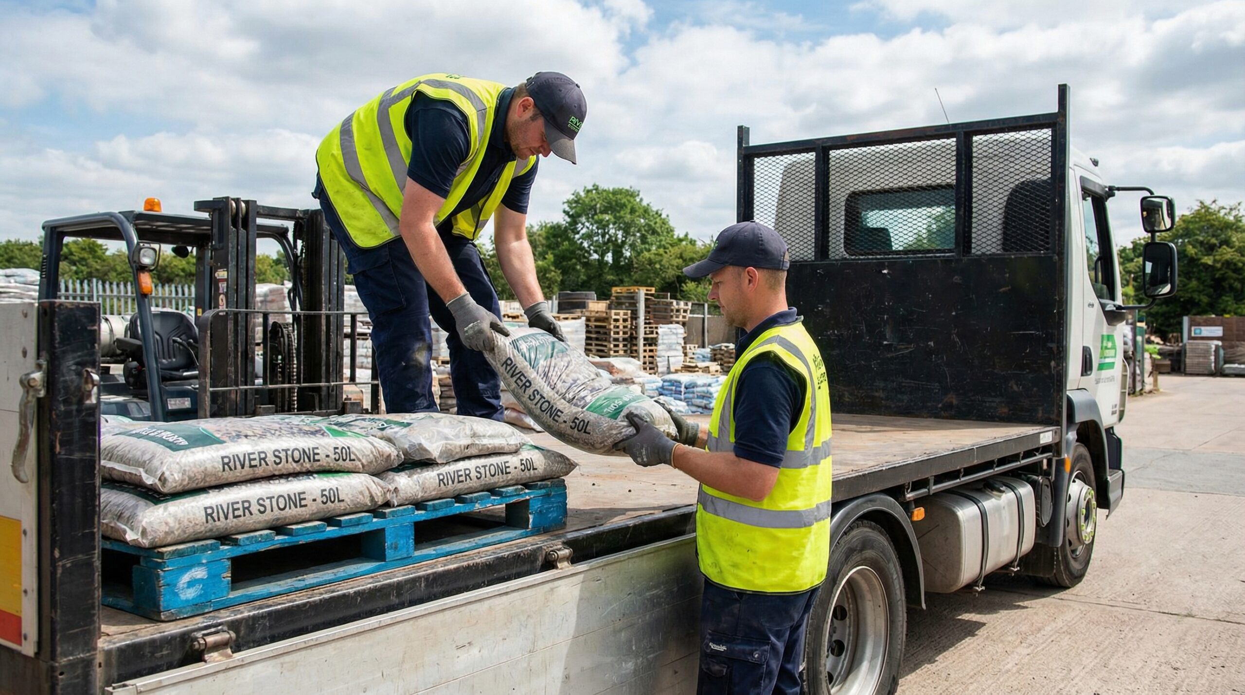 professional loading stone bags onto delivery truck